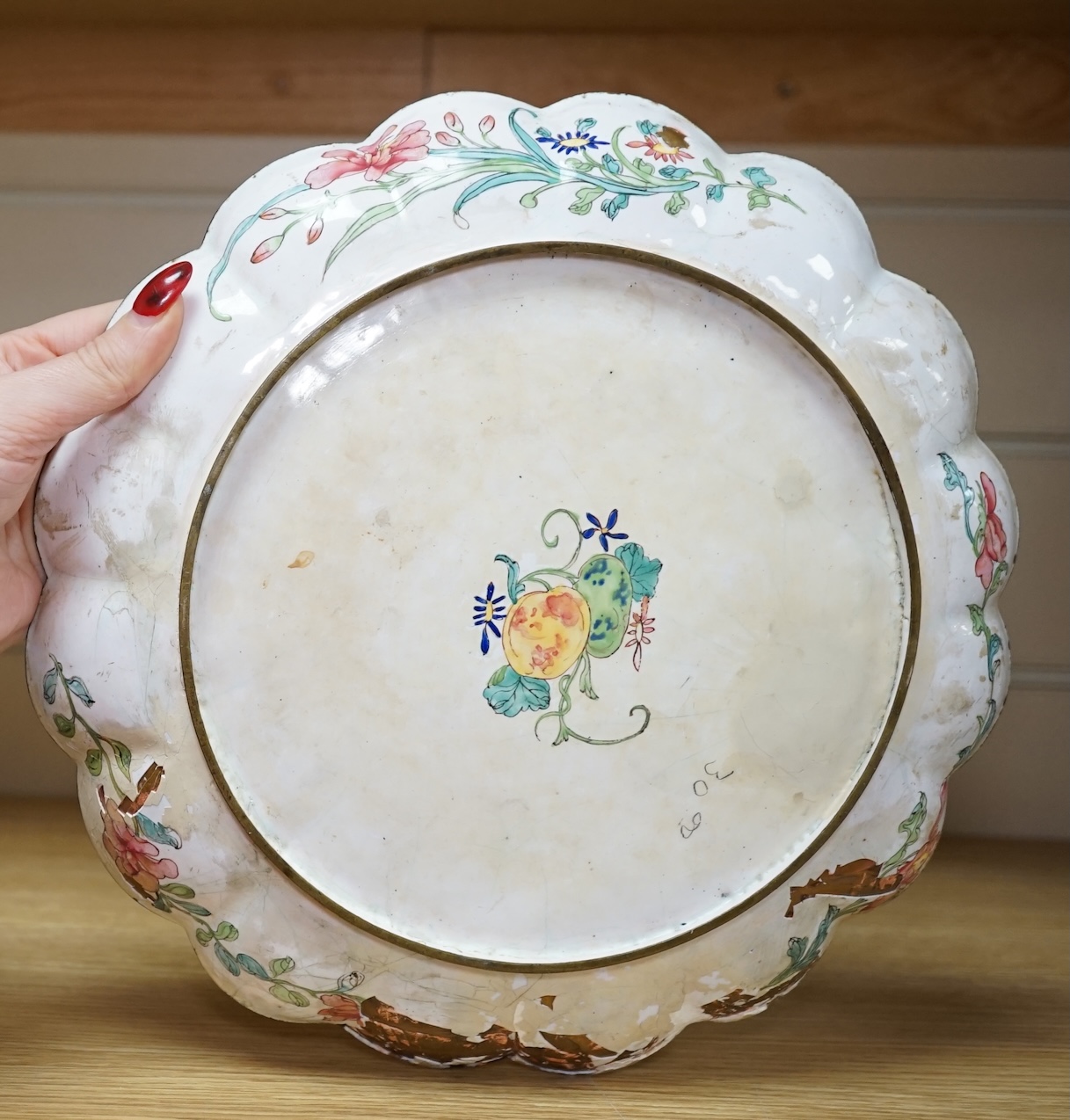 A pair of Chinese Guangzhou enamel vases, 19th century and an 18th century Guangzhou enamel dish, largest 26cm in diameter (3). Condition - fair